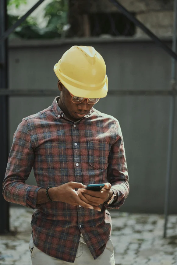 Drop a photo: a tech on site, phone at their mouth, mid voice note